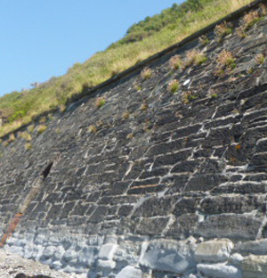 Masonry wall repairs in tidal areas with marine mortar