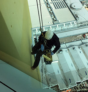 Abseiler applies Flexcrete products to Spinnaker Tower